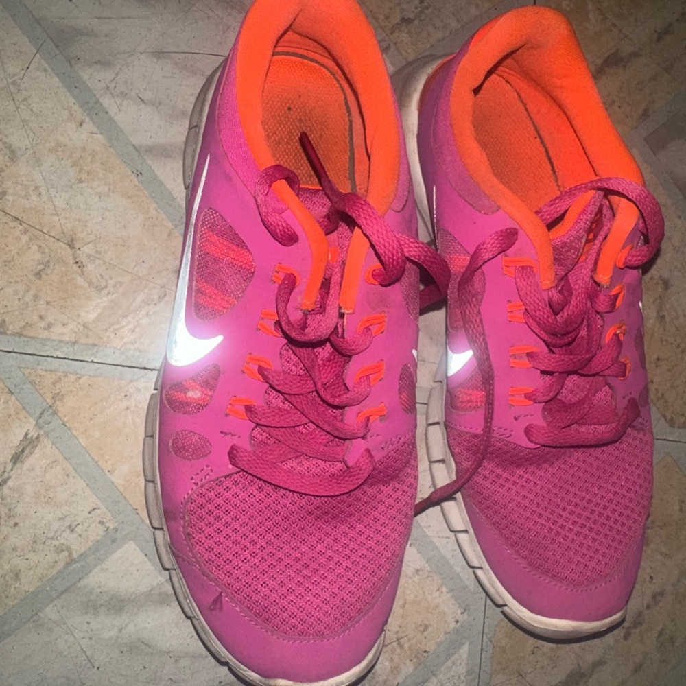 Nike Women's Pink Running Sneakers with Orange Trim